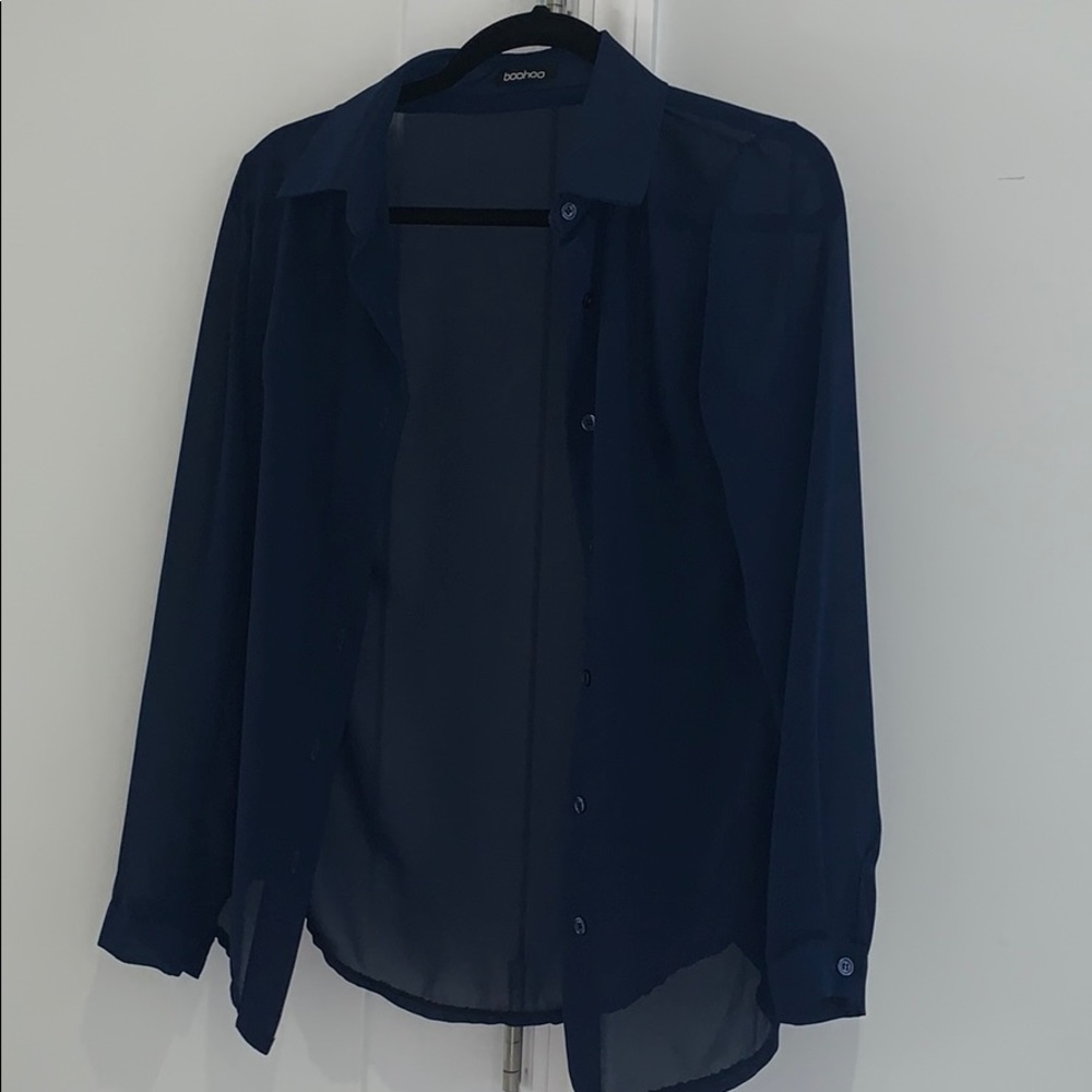 Sheer blue button down blouse.